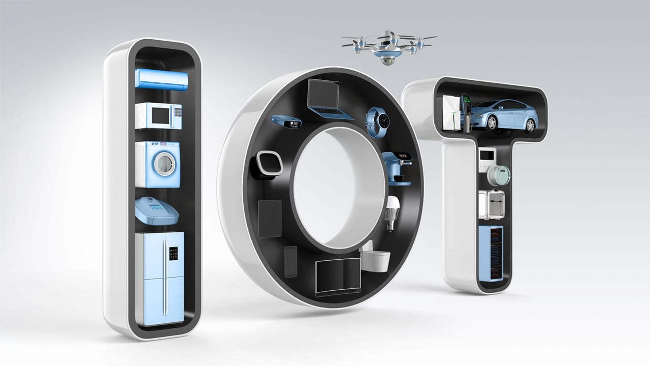 IOT spelled out using electronic gadgets and appliances.