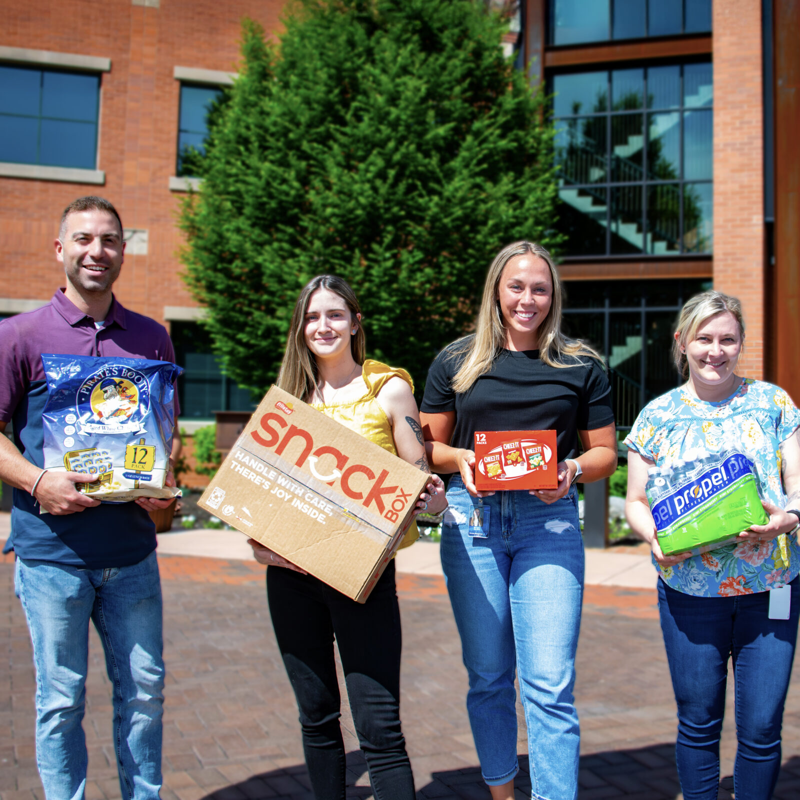 Group of people standing in front of food bank.